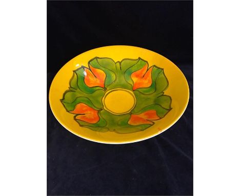 A Poole pottery Aegean large bowl, with yellow glaze and green and orange geometric flower pattern, shape '58', decorator's m