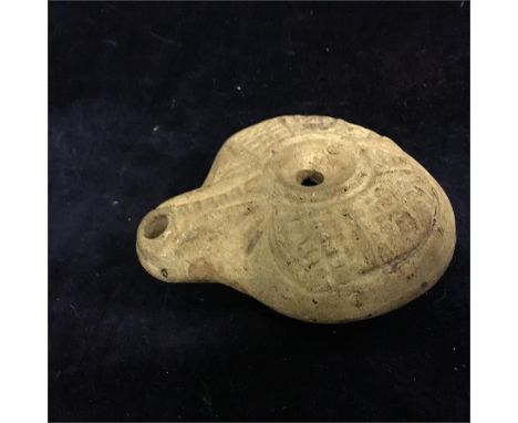 An Ancient Egyptian lamp recovered in 1862, see rear label for details 