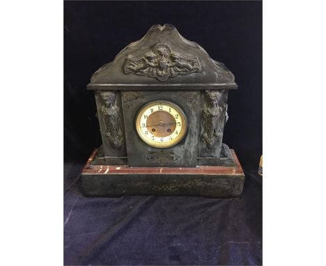 A slate clock on a marble base