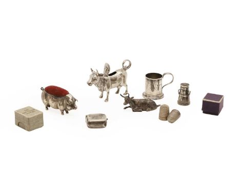A silver pig form pin cushion,  Birmingham 1903,  7cm long, together with a collection of silver miniature items to include, 