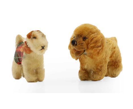 A small Steiff cocker spaniel, mid-20th century,12.5cm long,together with another stuffed terrier, with jacket inscribed 'Gin