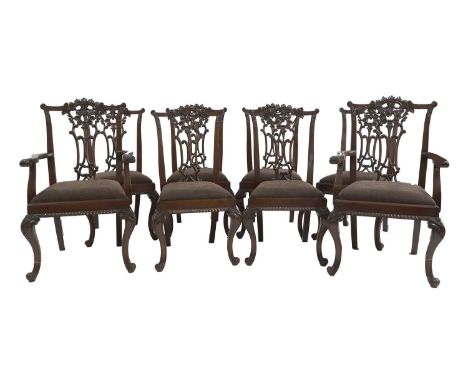 A set of eight Chippendale style mahogany dining chairs, 20th Century, the acanthus and C scroll backs above drop in seats on