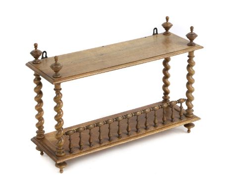 A two-tier hanging wall shelf, 19th century, with barley twist supports and low galleried front56cm wide20cm deep45cm highCon