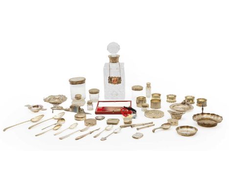 A collection of silver items, comprising six silver napkin rings, two silver dishes, a modern silver mounted whisky decanter,