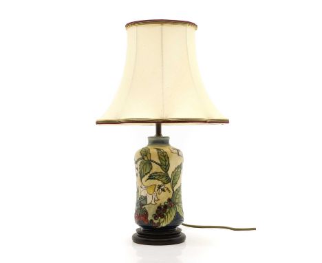 A Moorcroft 'Strawberry' pottery table lamp, modern, with a cream shade, with a multicoloured trim, 49cm highCondition Report