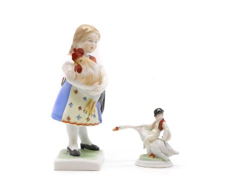 Two Herend porcelain figures 20th century, printed marks, of a girl holding a rooster,20cm highand a boy riding a goose,8cm h