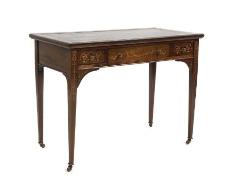 An Edwardian inlaid mahogany writing table Sheraton Revival, the rectangular top above three frieze drawers with scrolling fo