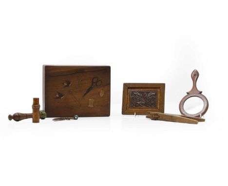 A collection of treen items comprising an  inlaid workbox, c.1900, 22.5cm wide, and further items, a carved panel, 14.5 x 11.