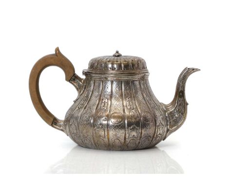 A Victorian silver teapot,  by Garrard & Co, London, of squat form with chased decoration and carved wood handle, with stampe