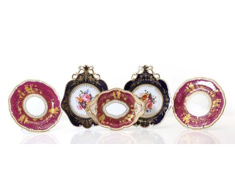 A pair of Spode porcelain plates 19th century, the burgundy ground heightened in gilt with figural decoration,23cm diameterto