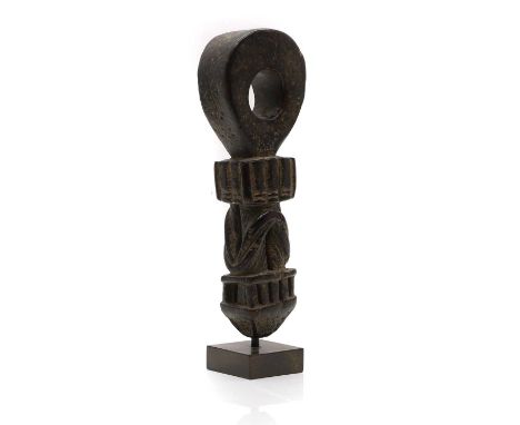 A Nepalese carved wood butter churn handle, probably 19th century, mounted on a stand, 27cm highCondition ReportFair overall.