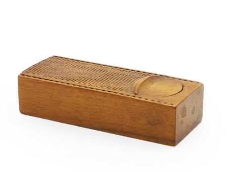 A treen walnut carved snuff box late 19th century, with sliding cover, 11.5cm wide4.6cm deep2.8cm high