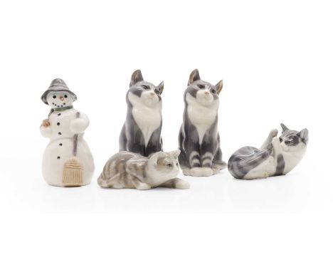 A group of Royal Copenhagen figures, comprising four cats,each in various poses, each with painted and printed marks, largest