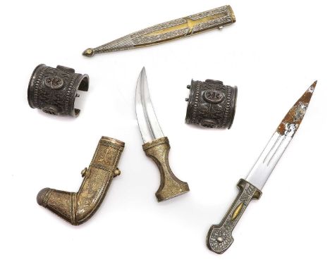 A Iranian silver metal mounted Jambiya  20th century, engraved decoration 20.5cm  and another dagger 36cm and a pair of amule