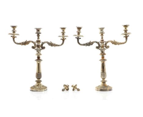 A pair of Old Sheffield Plate three light candelabra,  19th century, the scrolled arms above tapering columns with acanthus l
