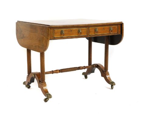 A Regency inlaid rosewood sofa table, the rectangular top with twin flaps above two frieze drawers on turned uprights and dow