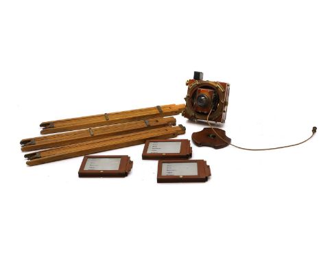 A Thornton Pickard mahogany and brass plate field camera, early 20th century, with Aldis lens and roller blind cord with thre