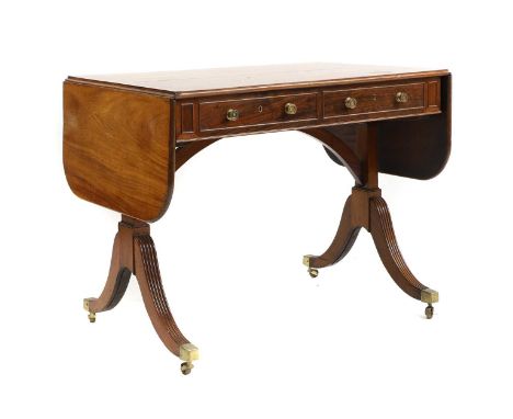 A mahogany sofa table, c.1820, manner of Gillow, with drop flap ends over two short drawers with dummy drawers to the reverse