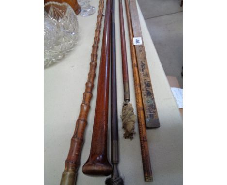 Vintage Yard stick, Bamboo walking cane, 2 Gun cleaning rods and assorted sticks