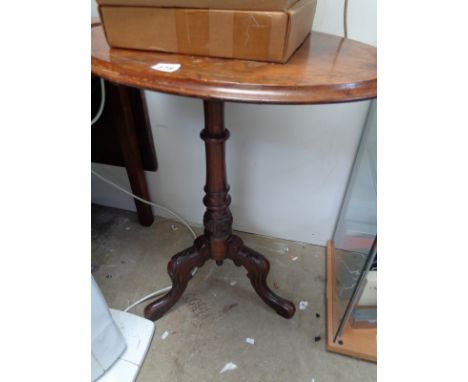 Victorian oval walnut topped table on carved tripod support