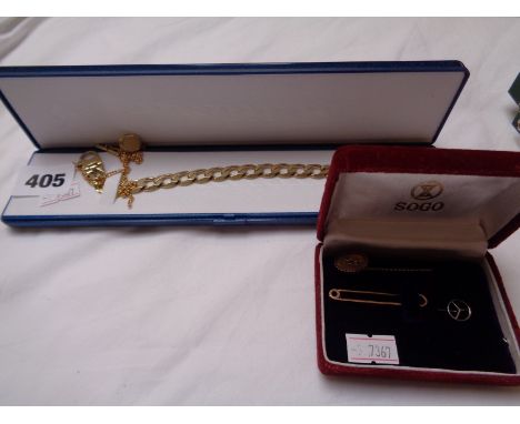 Gents Yellow metal curb bracelet 27g total weight Ruby Set stick Pin, Yellow metal Tie Pin etc.