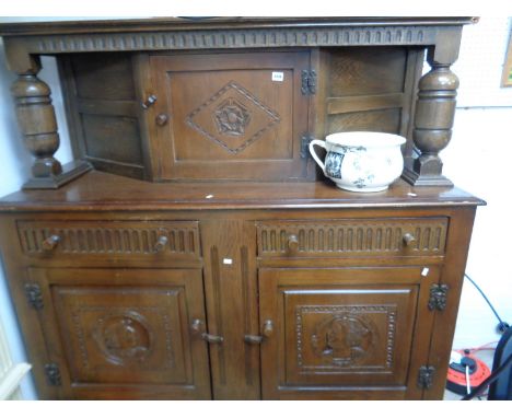 Oak Court cupboard with portrait panel doors