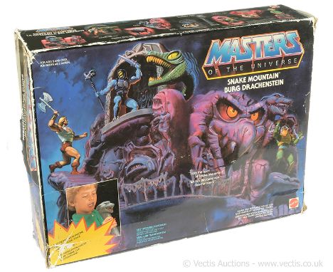 Mattel vintage Masters of the Universe Snake Mountain, Good Plus, Complete, within Fair water damaged opened box.
