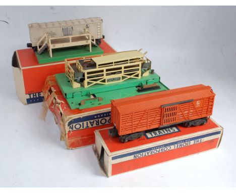 Lionel operating cattle car no. 3656 complete with car and lineside apparatus, various chips and marks, but (G-BP) with opera