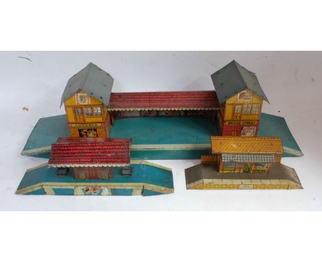Brimtoy pre-war No. 54 Junction station missing two tinprinted lamps and signal and buildings covered with various Hornby pre