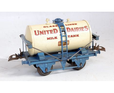 Hornby 1934-7 United Dairies Milk tank wagon with lighter blue standard base, white tank, no drain cocks, corrosion to rods o
