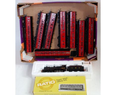 Tray containing Mainline LMS black class 2P 4-4-0 engine and tender (G), 8x LMS red bogie Midland low roof suburban coaches (