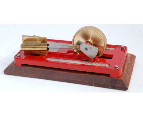 A kit built stationary horizontal mill engine comprising of single oscillating cylinder with opposing counter wheel and unspo