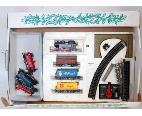 A Hornby Junior Freight set, comprising an 0-4-0 engine, 3 wagons, track and battery controller in foam box base only, 3 othe