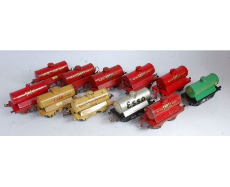 Eleven Hornby tank wagons, various ages pre and post war: 6x Shell Motor Spirit red, 1x Royal Daylight, 1x Manchester Oil, 1x