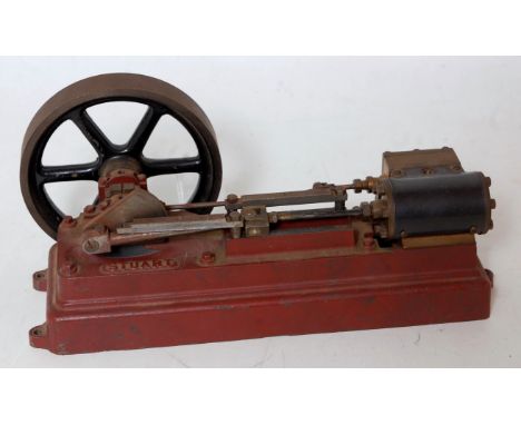 A Stuart Turner horizontal stationary steam engine comprising of single cylinder with slip eccentric powering a heavy spoked 