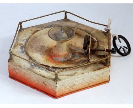 An early 20th century Bing tinplate and steam powered model of a hexagonal water fountain comprising of brickwork base with s