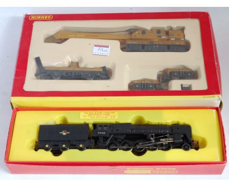 A Hornby R550 BR black class 9F 2-10-0 engine and tender has been weathered (GR-BG) and sold with R6204 factory weathered 75 