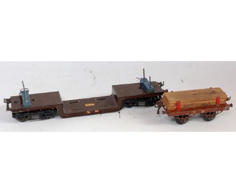 Hornby 1928-30 dark brown base SR trolley wagon with blue bolsters and gold SR both sides, chips to base (F-G), with a 1928-3