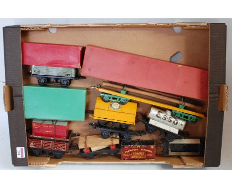 7 post war and one pre war Hornby wagons: 1933-5 No. 2 lumber, yellow base, green bolsters and bogies with load (VG-E)(BVG), 