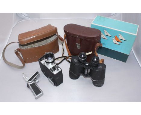 A pair of Carl Zeiss Jena 'Jenoptem' 7x50 binoculars, numbered 4216499, black lacquered finish (some losses), complete with b