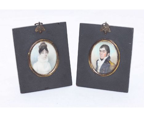 A pair of early 19th century oval portrait miniatures of a Royal Naval officer wearing epaulette's, and a young lady wearing 