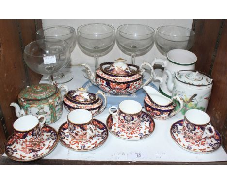 SECTION 32.  A Royal Crown Derby Japan pattern part tea set comprising Teapot, sugar, cream and four cups & saucers, together