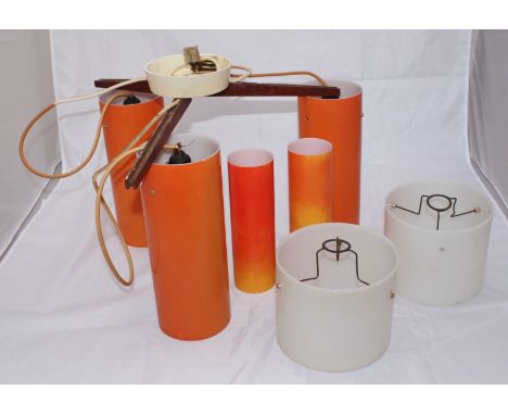 A retro 1960's three-light hanging ceiling light, with orange plastic shades, together with two white shades etc.