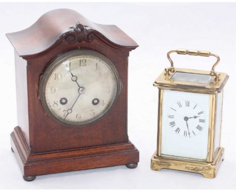 A French mahogany-cased mantel clock with silvered dial, movement striking a coiled gong, with key, approx. 18cm high, togeth