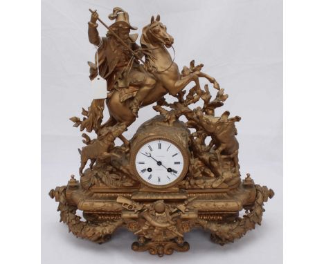 A 19th Century cast spelter figural mantel clock modelled as a medieval mounted-huntsman and two hounds hunting a wild boar, 