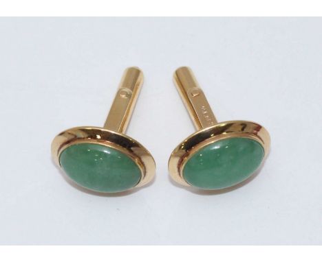 A pair of 18ct gold and jade Oriental oval cufflink's, the jade coloured stones measuring approx. 1.5x1cm, in Wai Kee, Hong K