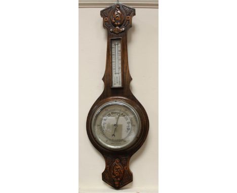 An oak-cased barometer, approx. 70cm