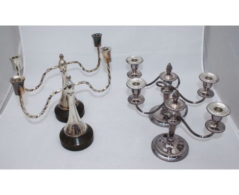 A pair of white metal Georgian style three-light candelabra with removable flame finials, gadrooned edges, maker Barker Ellis