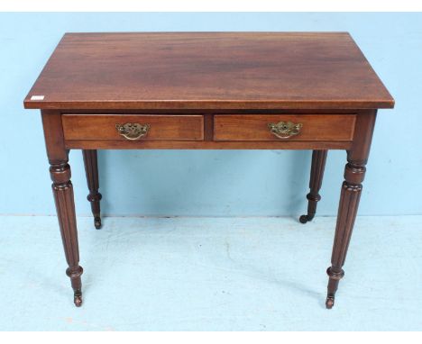 A 19th Century mahogany side table by Edwards &amp; Roberts, with two frieze drawers, raised on turned and tapering reeded su