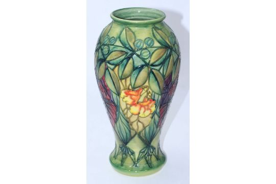 A Moorcroft Pottery Vase In The Rainforest Pattern Designed By